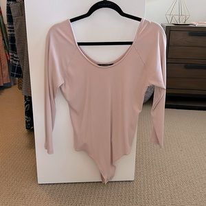 Banana republic 3/4 long sleeve light pink body suit. Slightly used.